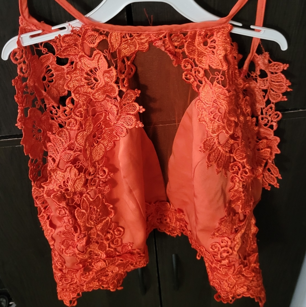 Dygarni  California dressy crop top with buttons .Open back. Great insert piece.
